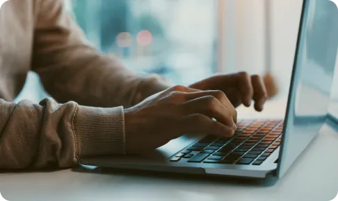 Person typing on keyboard